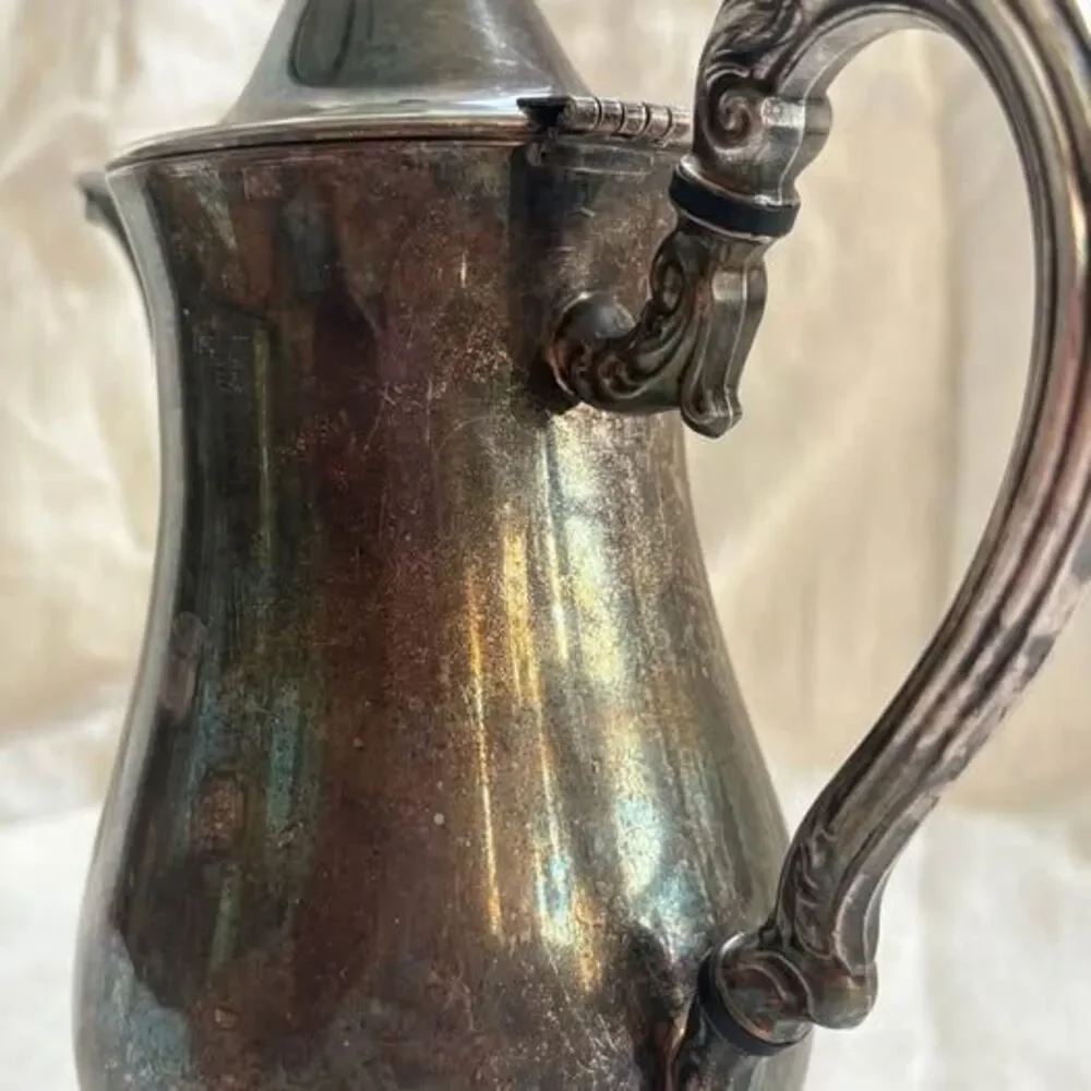 Unbranded ornate silver